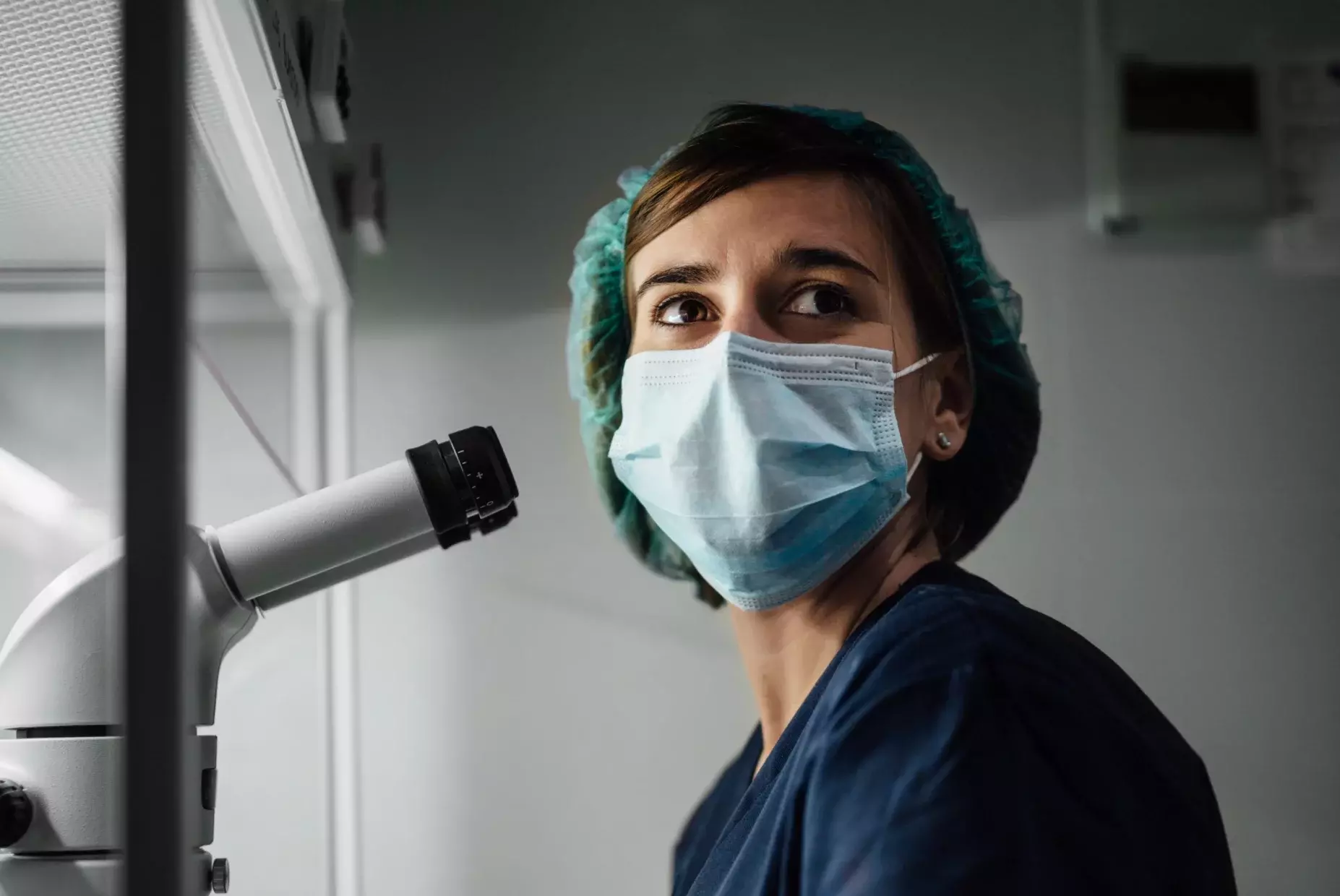 woman in mask and scrubs